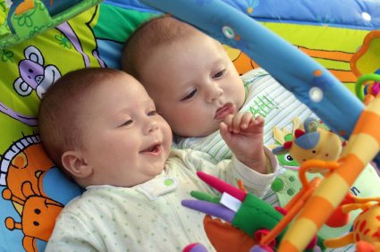 What and How Much to Play with Baby? 8 two baby boys playing