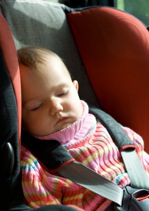 Tips for Traveling with Your Baby 8 baby girl sleeping in carseat on a long car journey