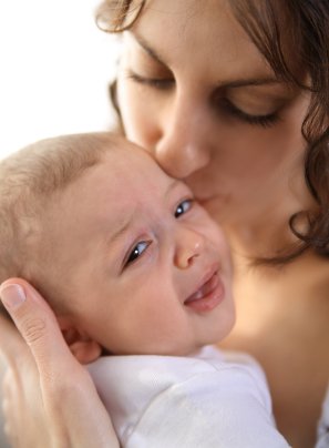Calming A Crying Or Colicky Baby 8 mom comforting upset baby